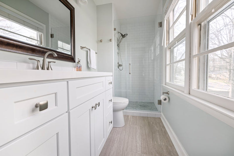 Frameless glass shower door installed in modern bathroom by High West Glass Castle Rock Colorado