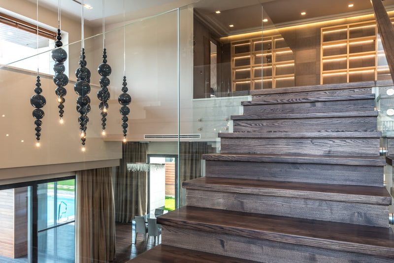 Frameless glass railing on residential staircase installed by High West Glass Colorado